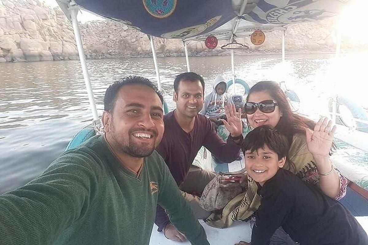 a group of people on a boat in the water