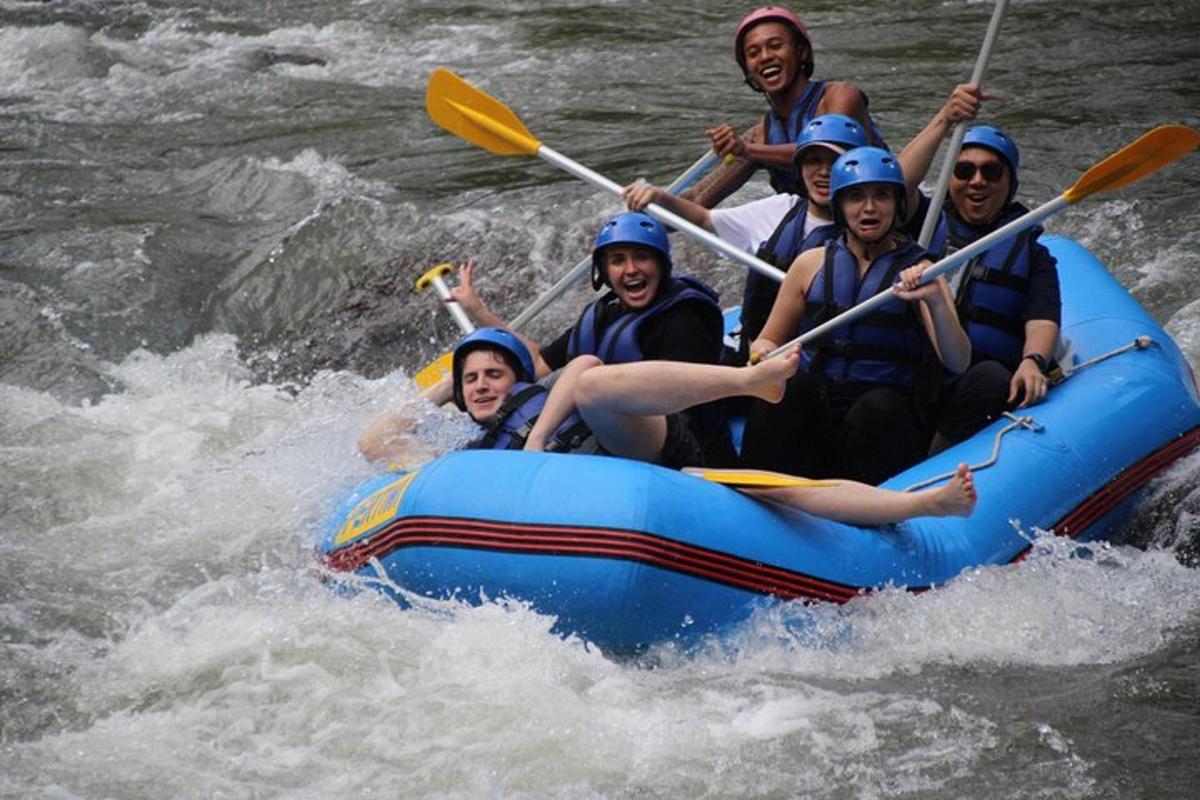 a group of people in a raft on a river