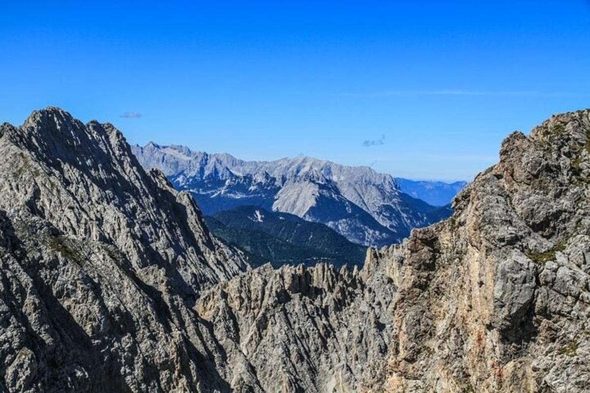 a view of a mountain range with mountains in the background