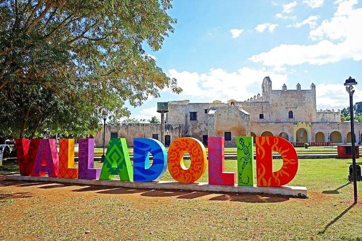 a sign that says welcome in front of a building