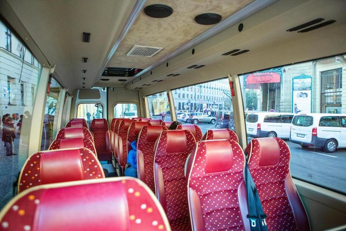 a bus with red seats on a city bus