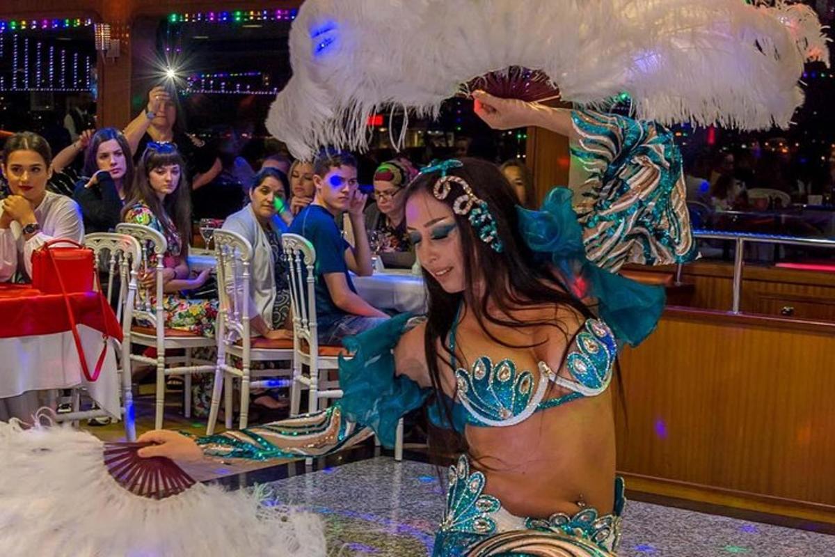 a woman in a mermaid costume in front of a crowd