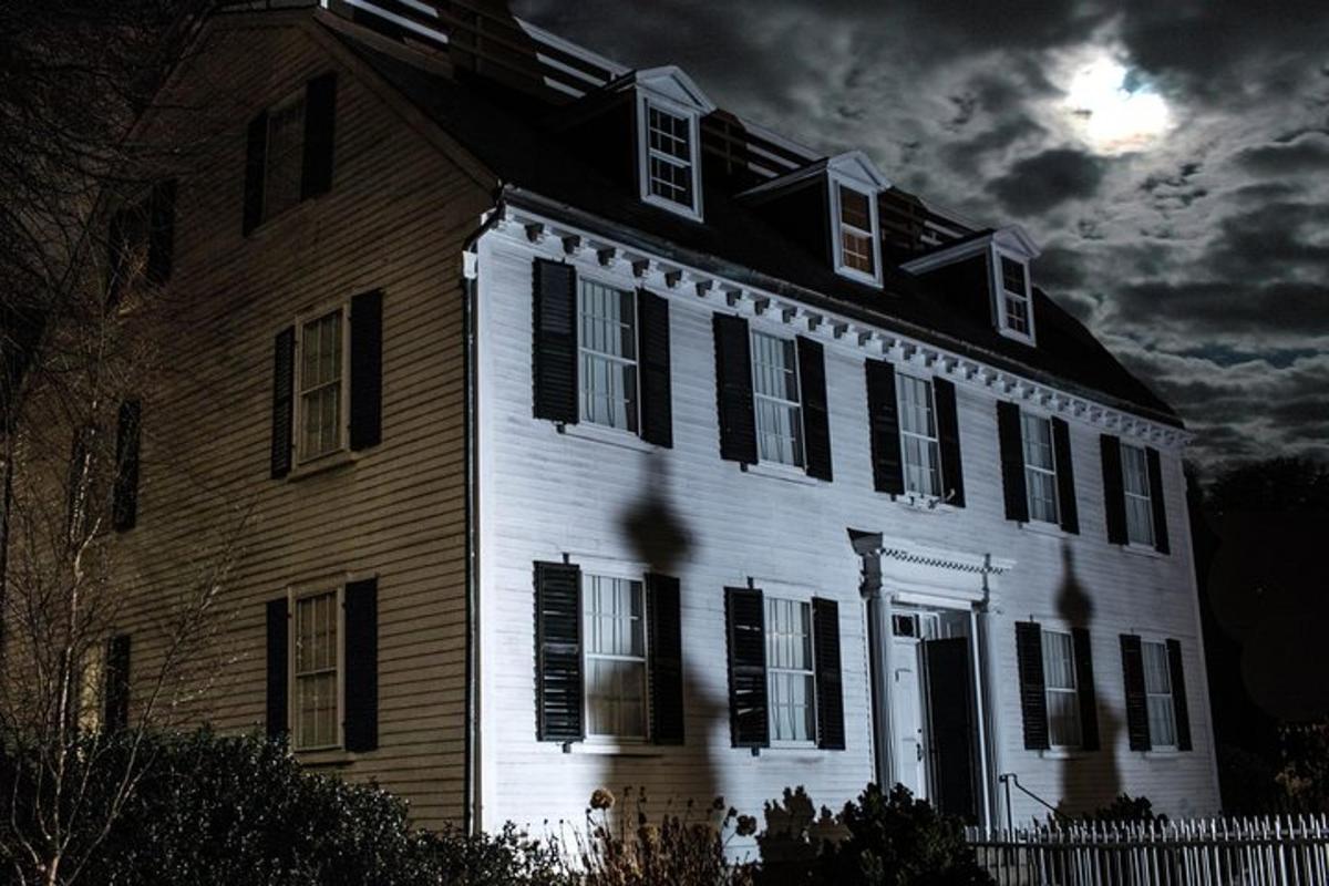 a large white house with a black roof