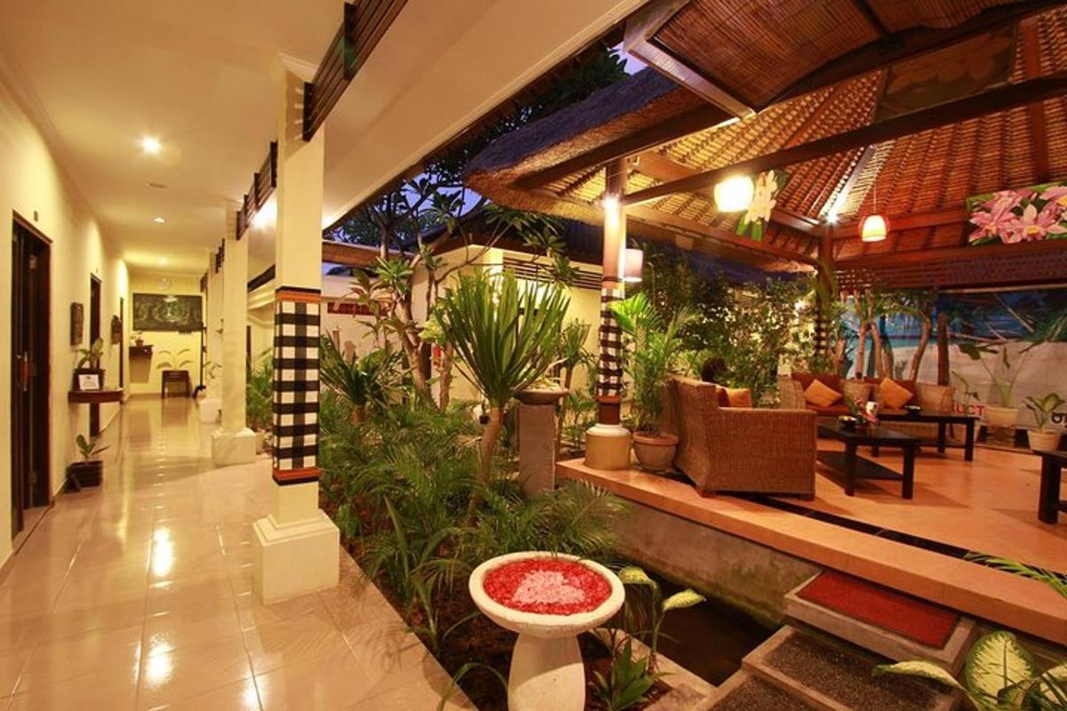 a lobby of a house with a lot of plants