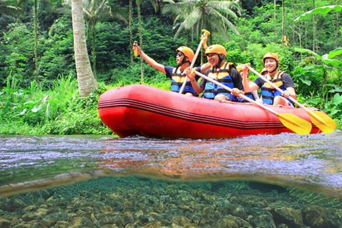 a group of people in a raft on a river