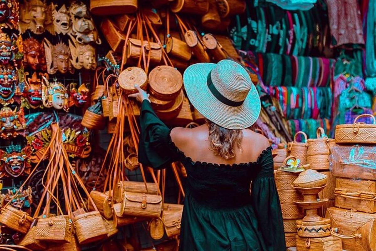a woman in a hat looking at a display of baskets
