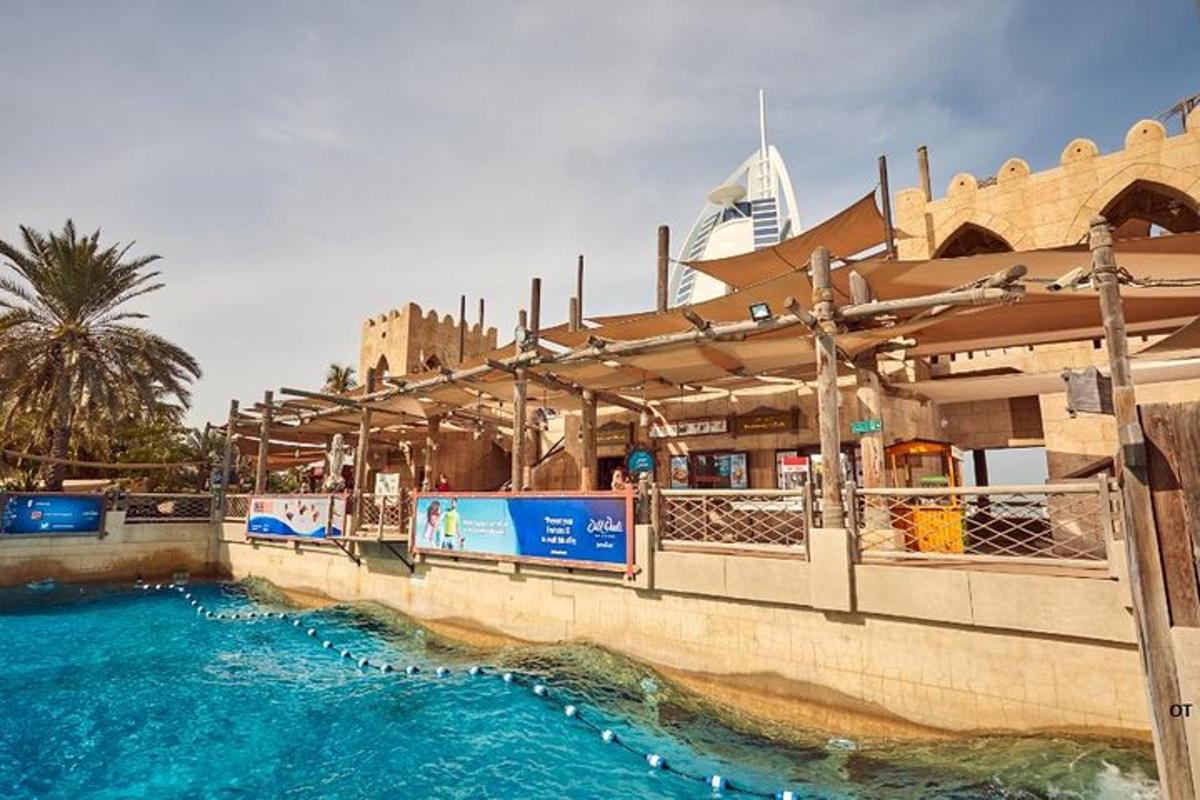 a pool of blue water next to a building