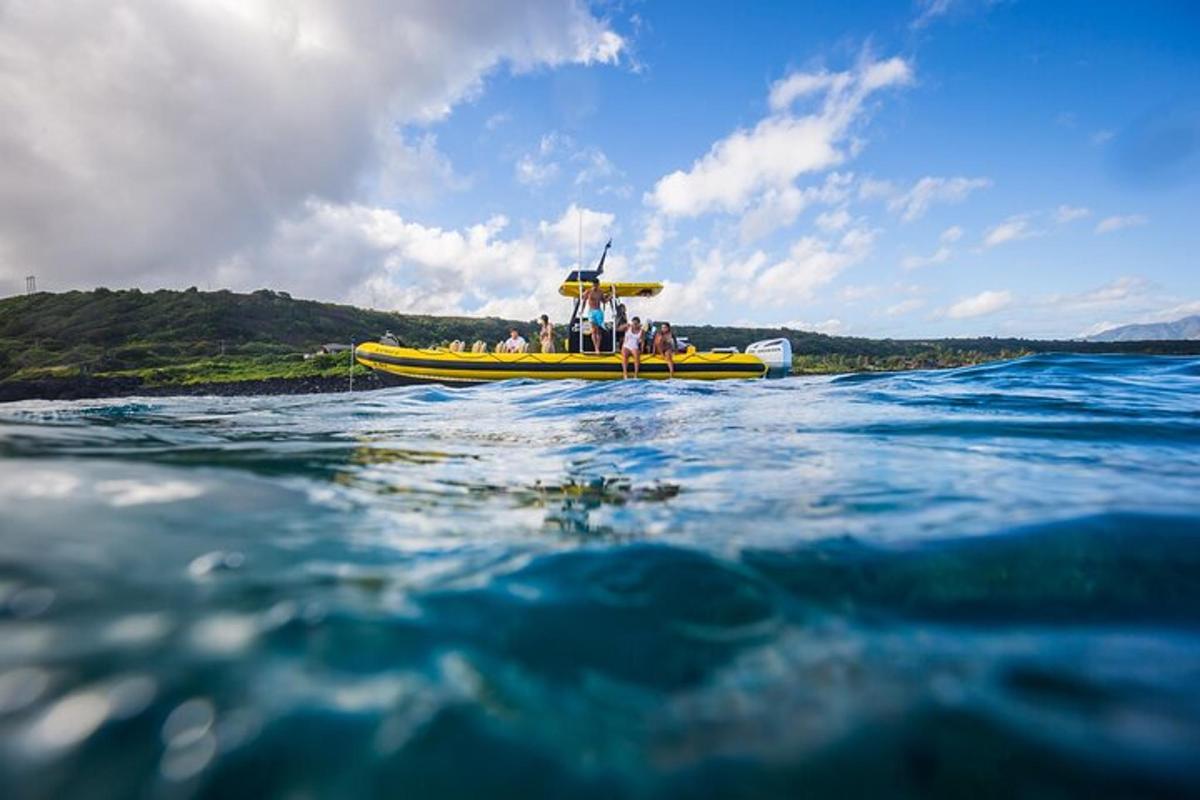 a group of people on a yellow boat in the water