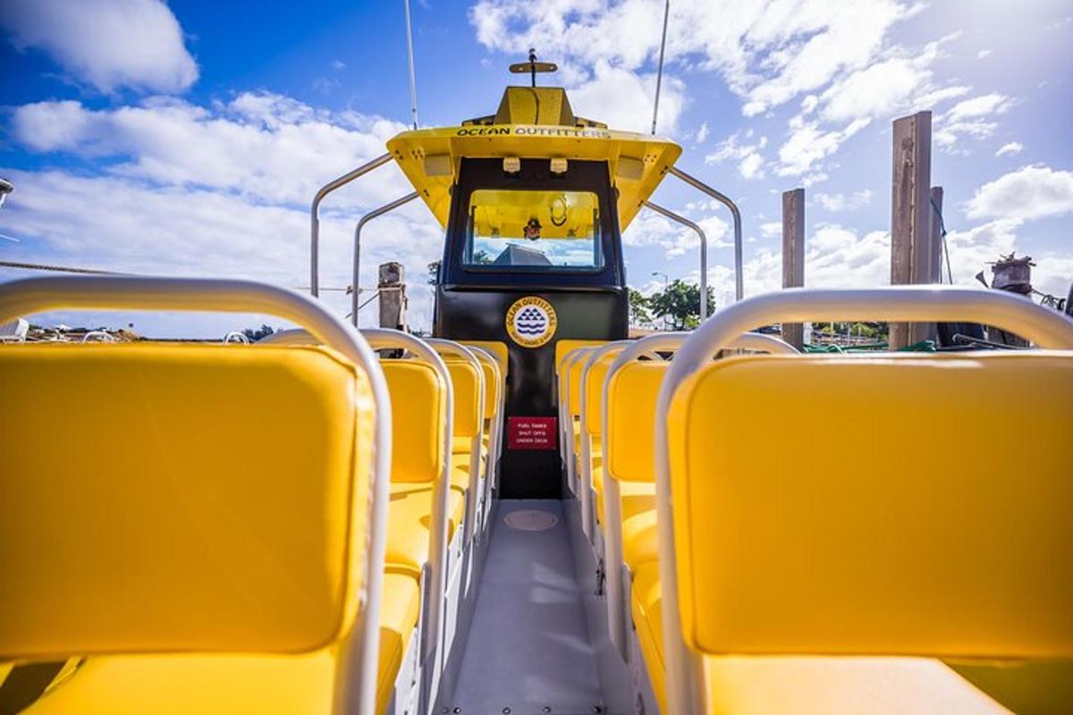 a yellow bus with empty seats on a bus