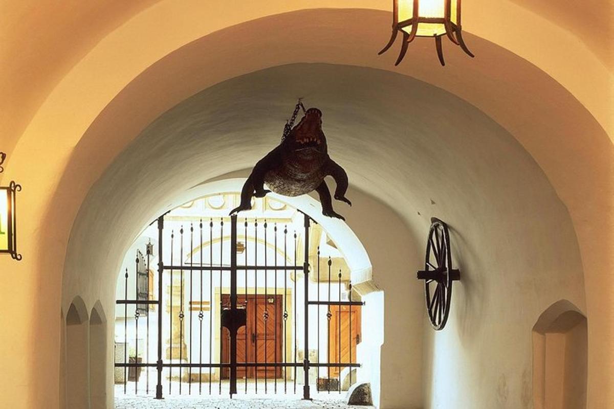 a statue of a frog on a gate in a church