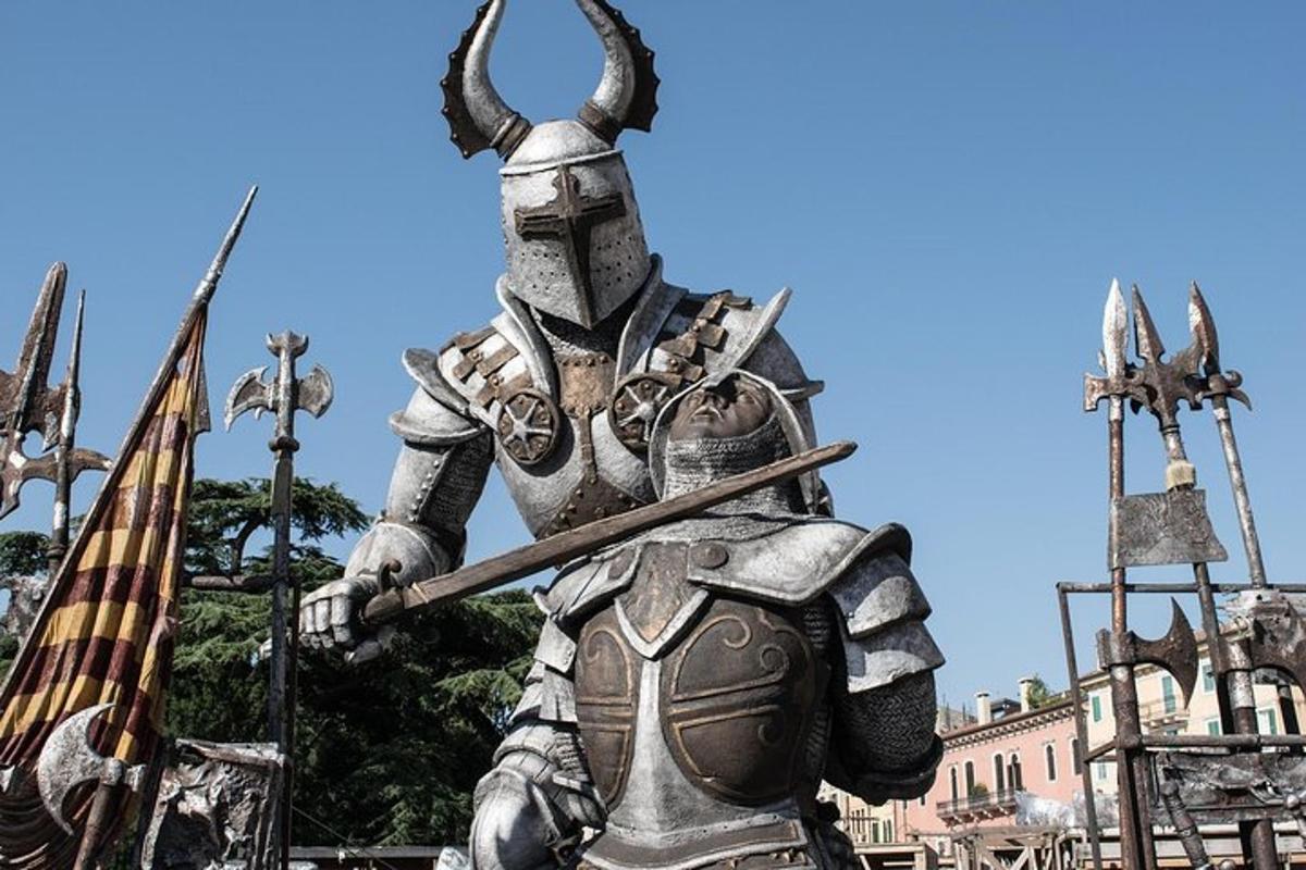 a statue of a knight holding a spear and a flag