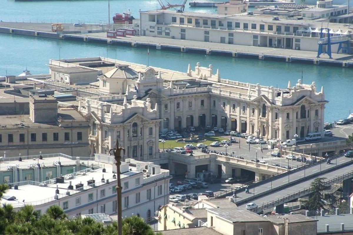 an aerial view of a large building next to the water