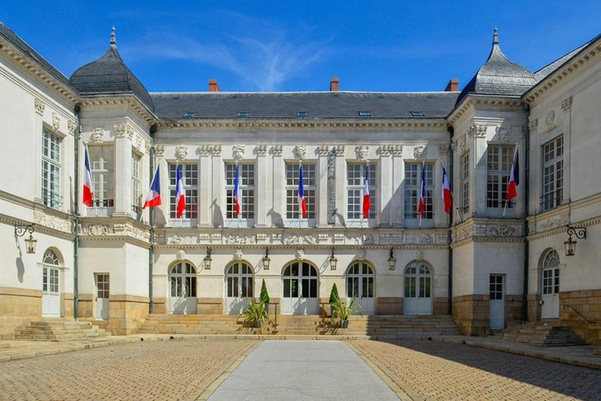 a large building with flags in front of it