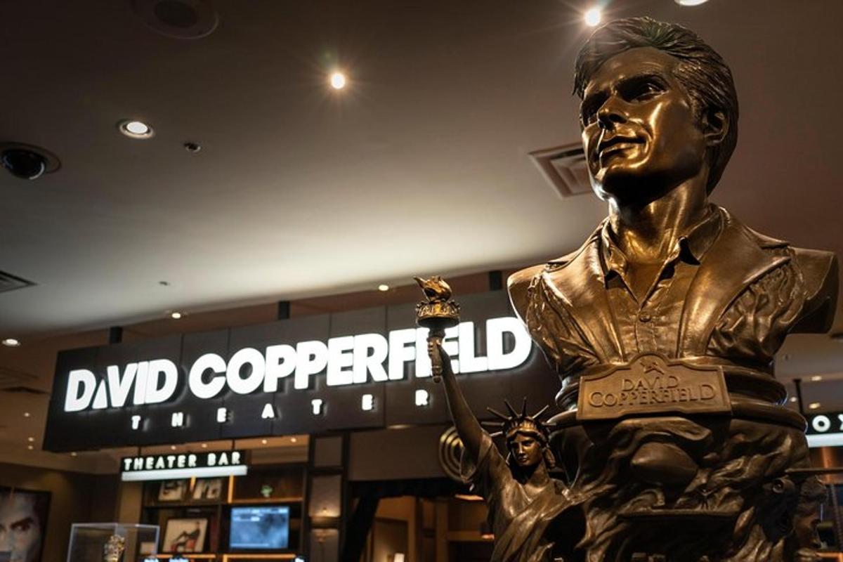 a statue of a man holding a trophy in a store