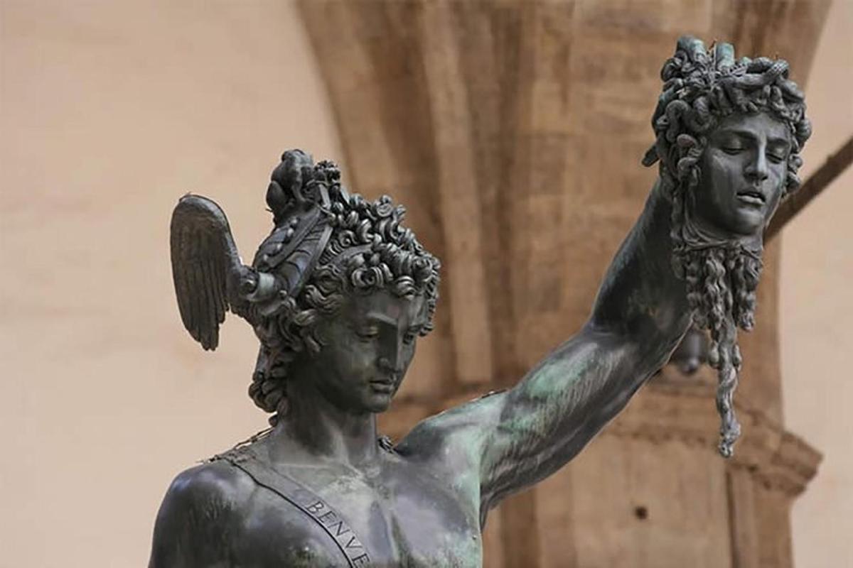 a statue of a woman with a bird on her head
