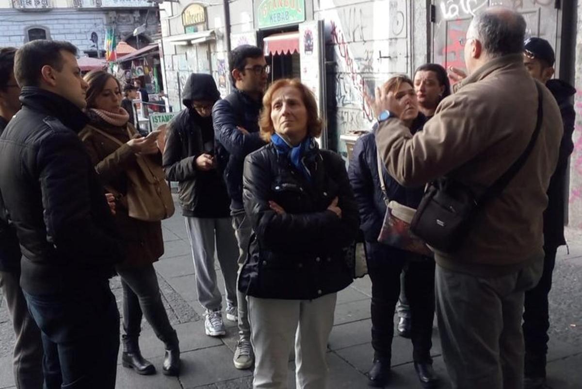 a group of people standing on a city street