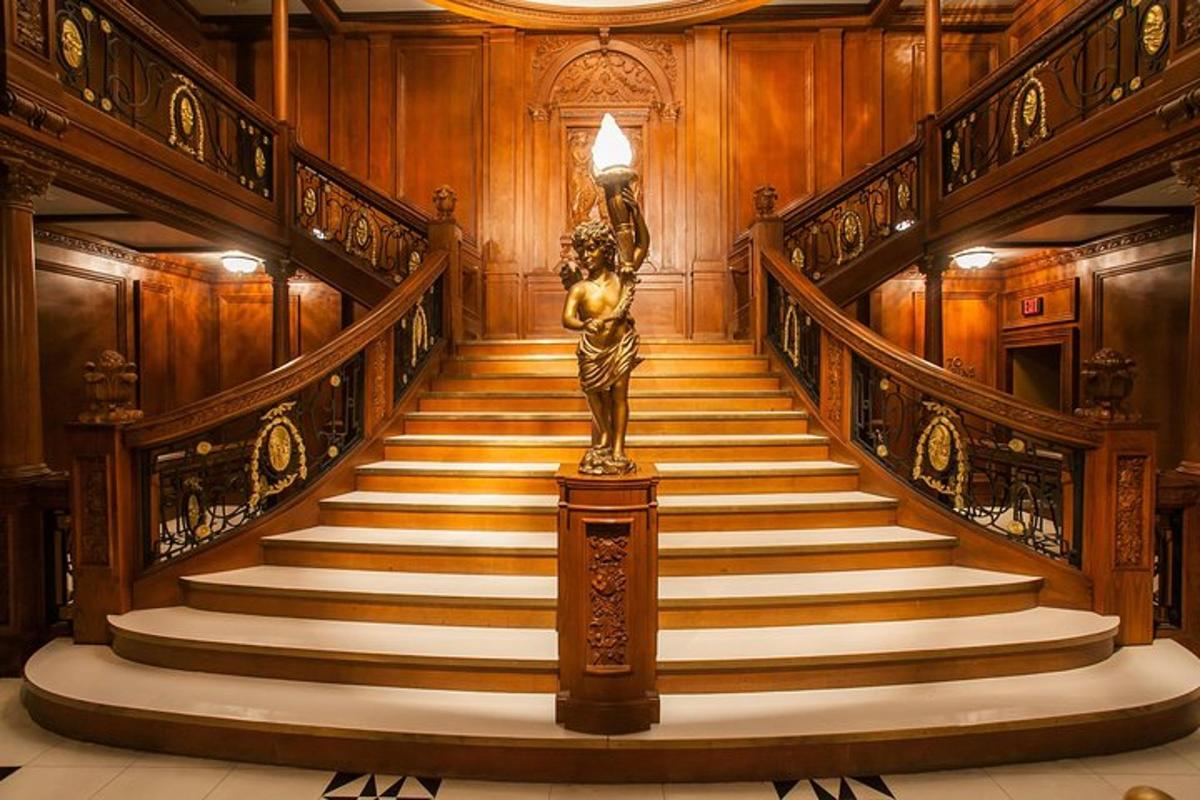 a staircase with a statue of a woman on it