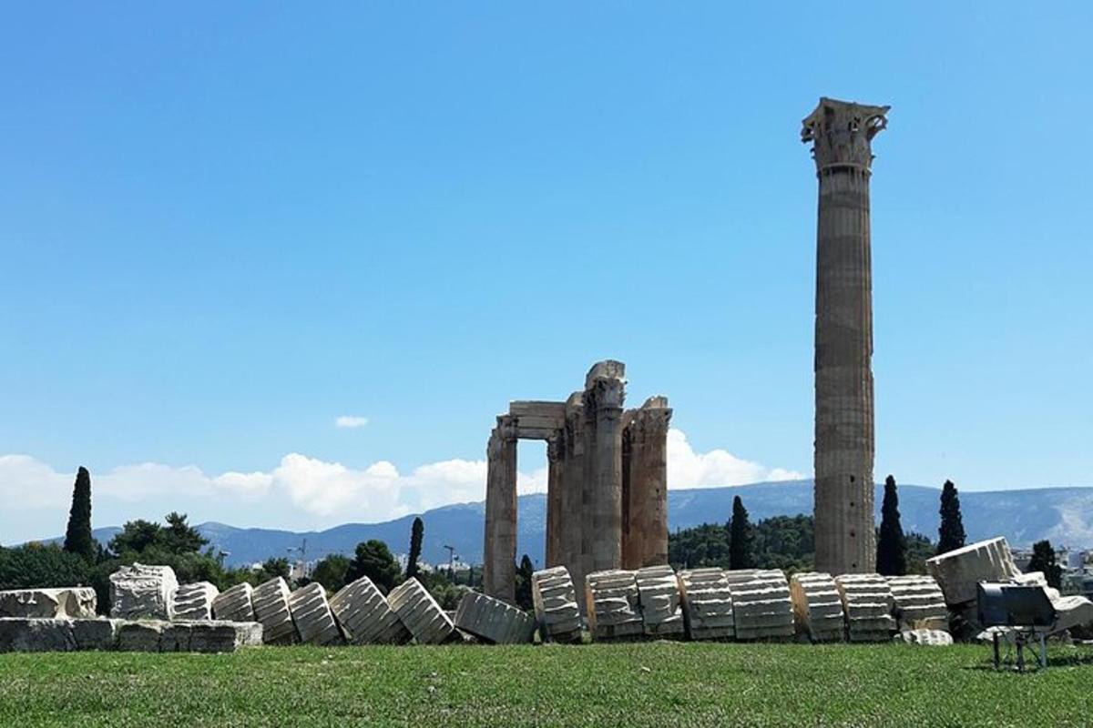 a group of ancient ruins in a grass field