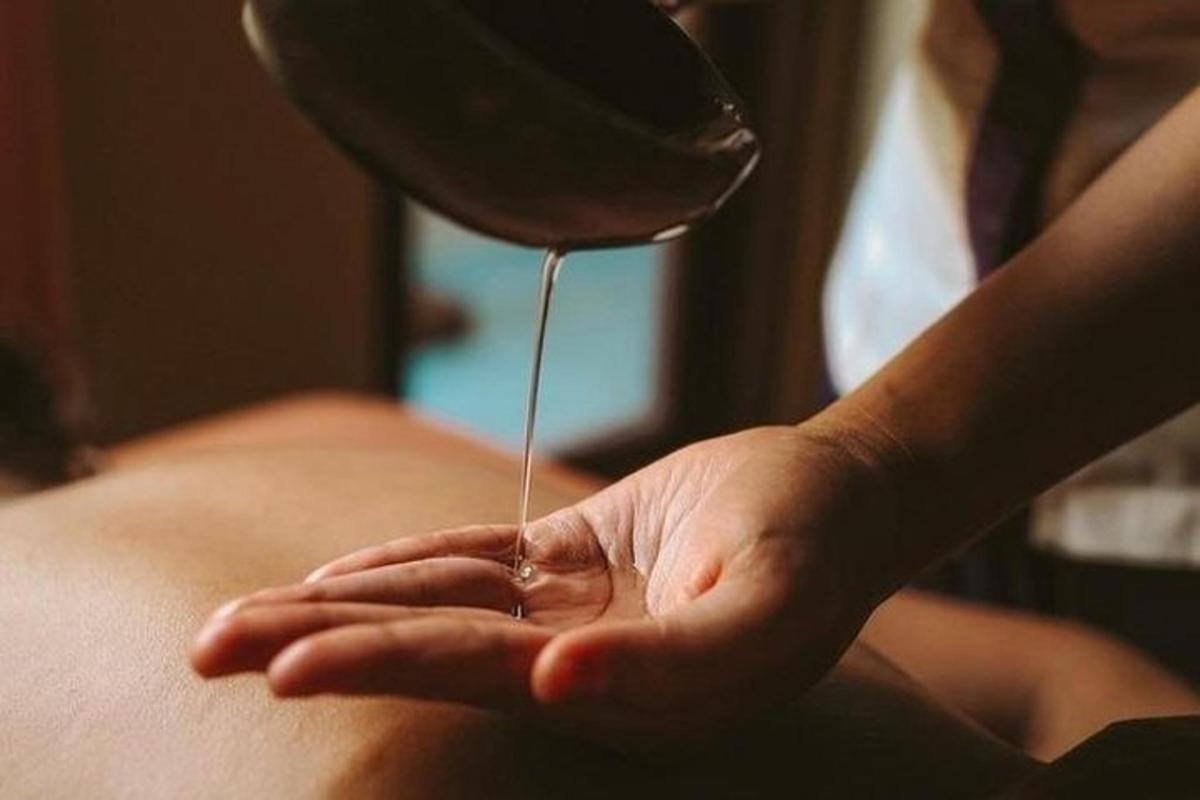 a person is getting asection of a persons leg with a needle