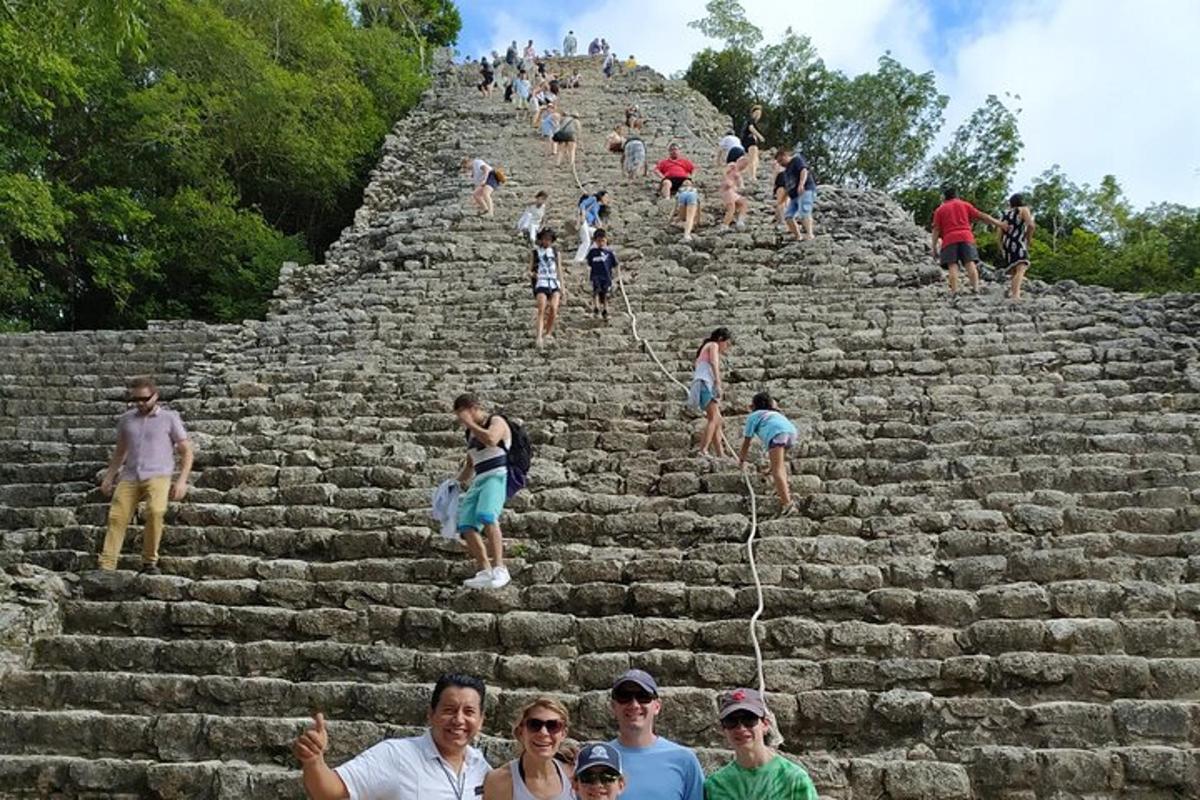 a group of people climbing up a pyramid