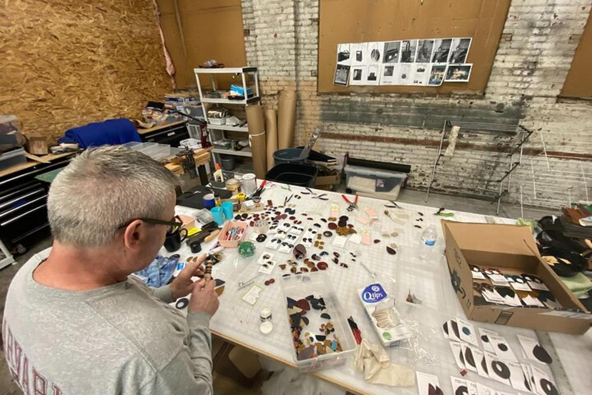 a man working on a table in a room