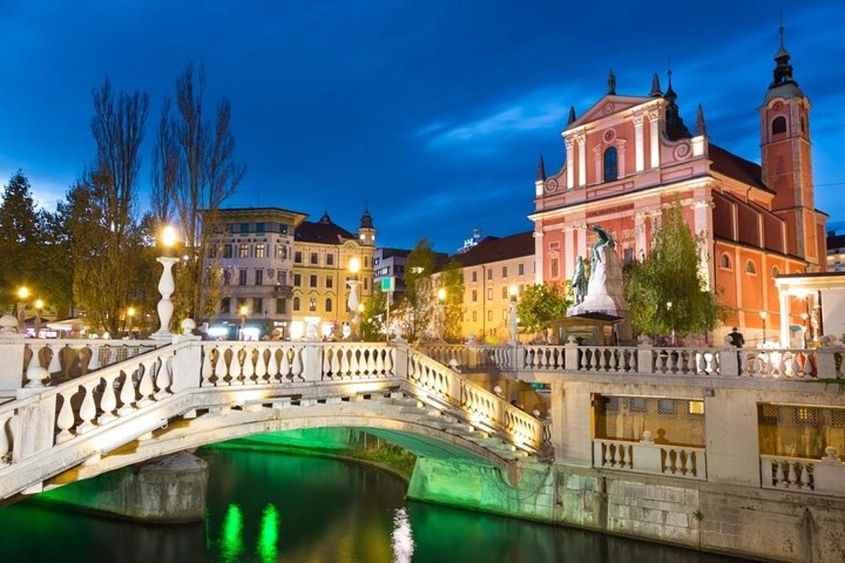 a bridge over a river in a city at night