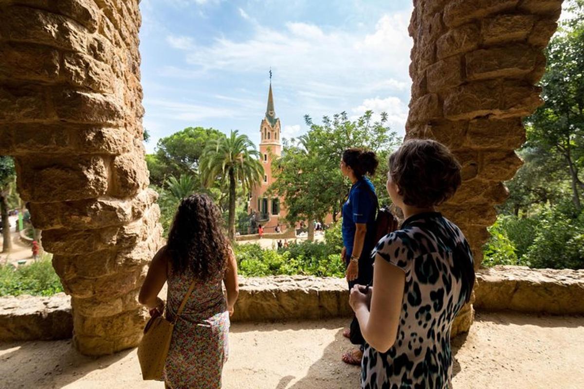 a group of people standing in a building looking at a church
