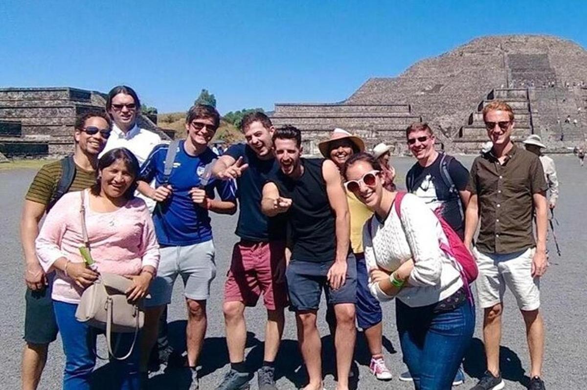a group of people posing for a picture at the pyramid