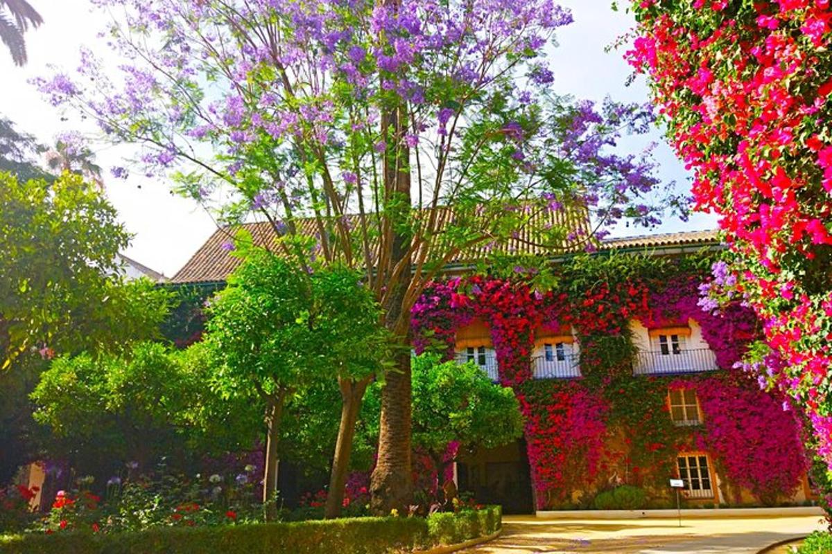 a building with flowers on the side of it