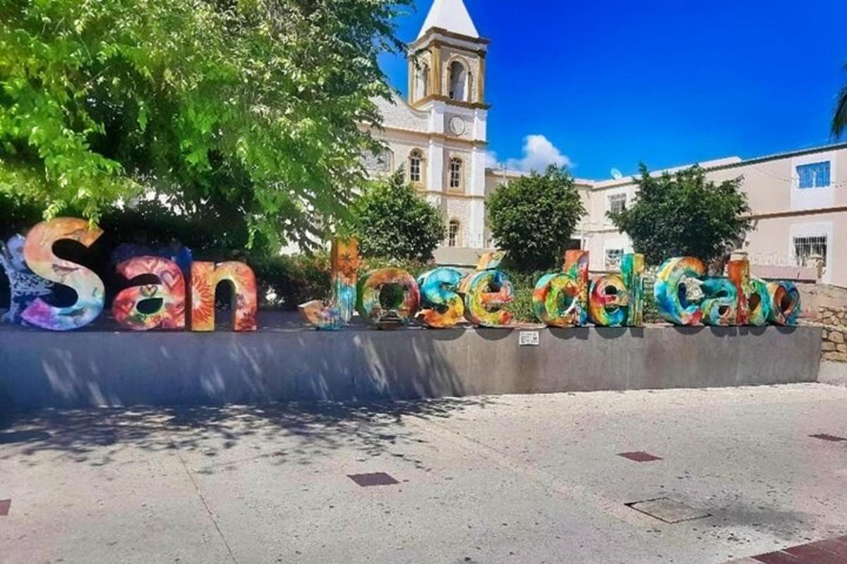 a wall with graffiti on it in front of a building