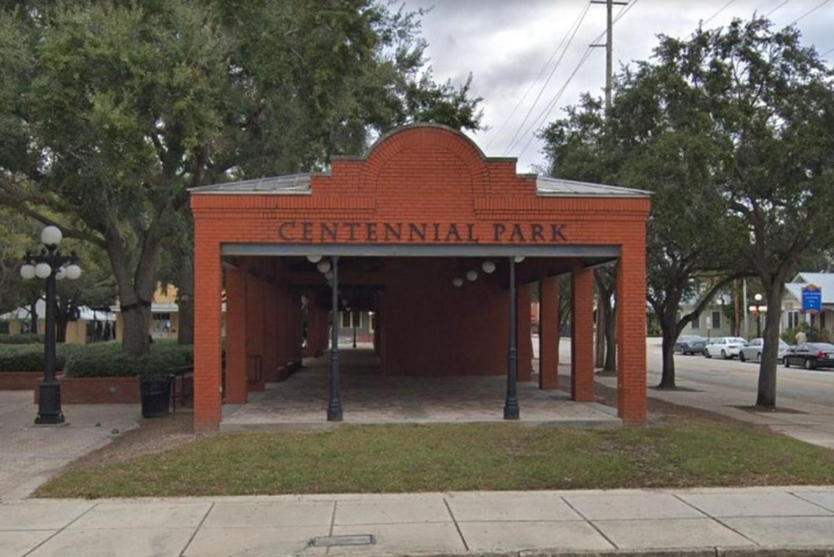 a brick building with a sign for a park