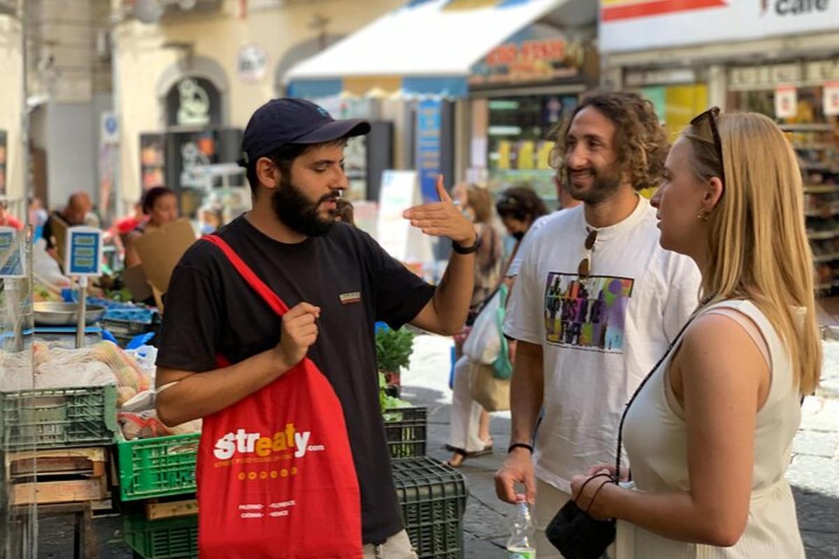 a group of three people standing in a market