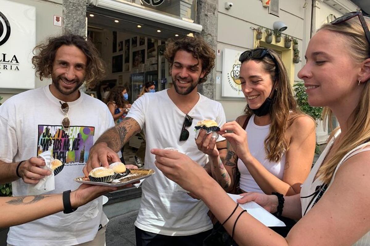 a group of people holding food on a plate