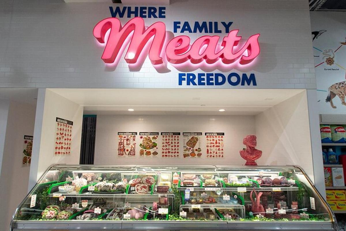 a store with a display of vegetables in a display case