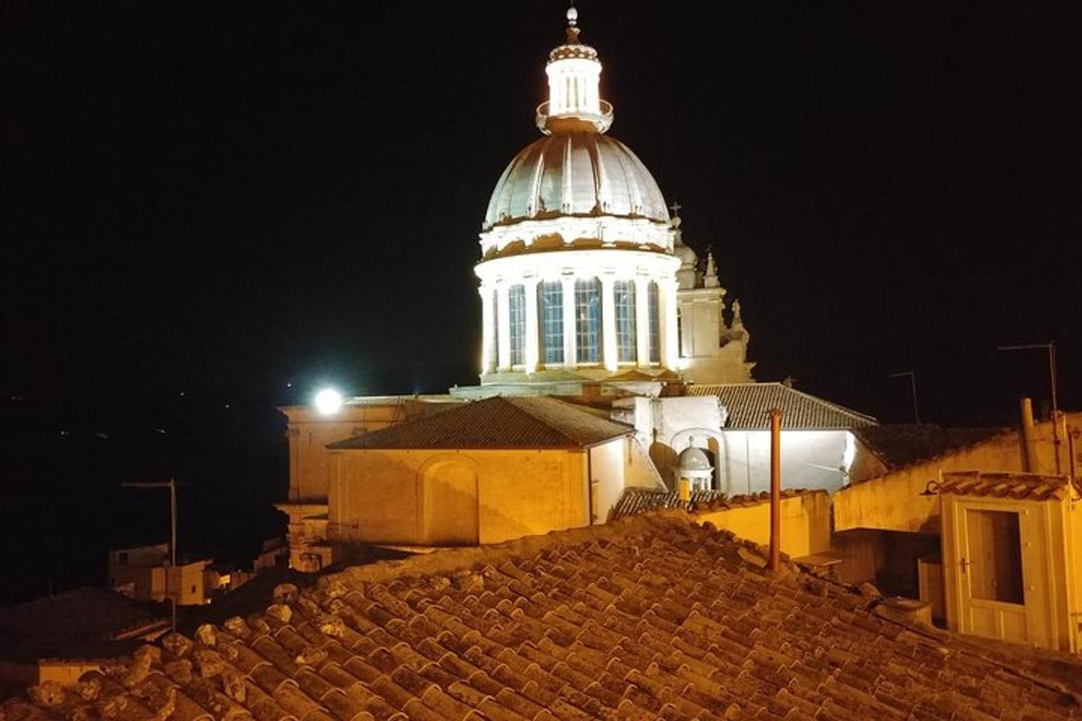 a building with a tower on top of it at night