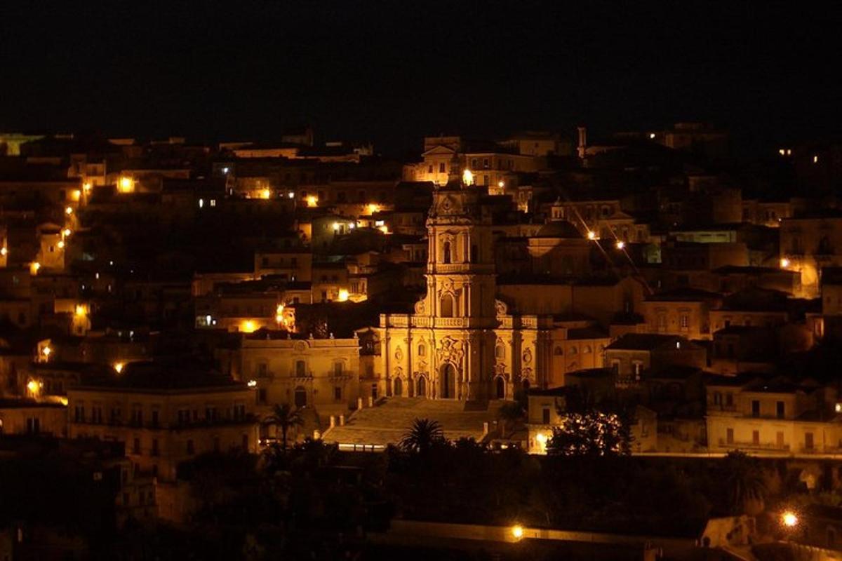 a view of a city at night with a building