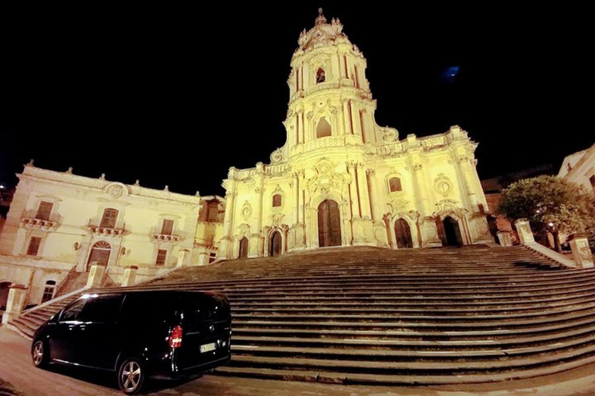 a black van parked in front of a building with stairs