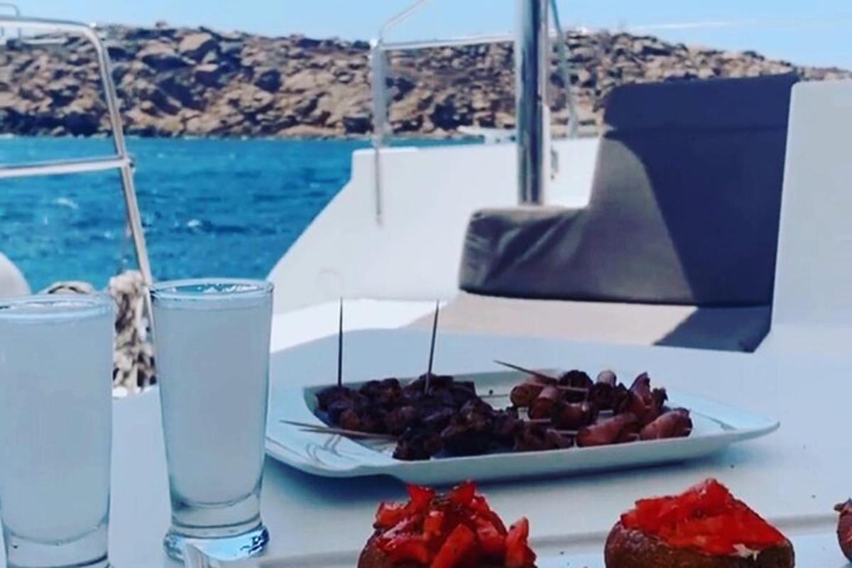 a table with a plate of food and a plate of water