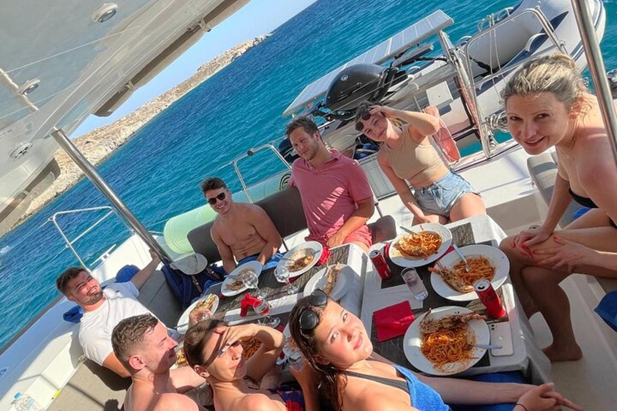 a group of people sitting around a table on a boat