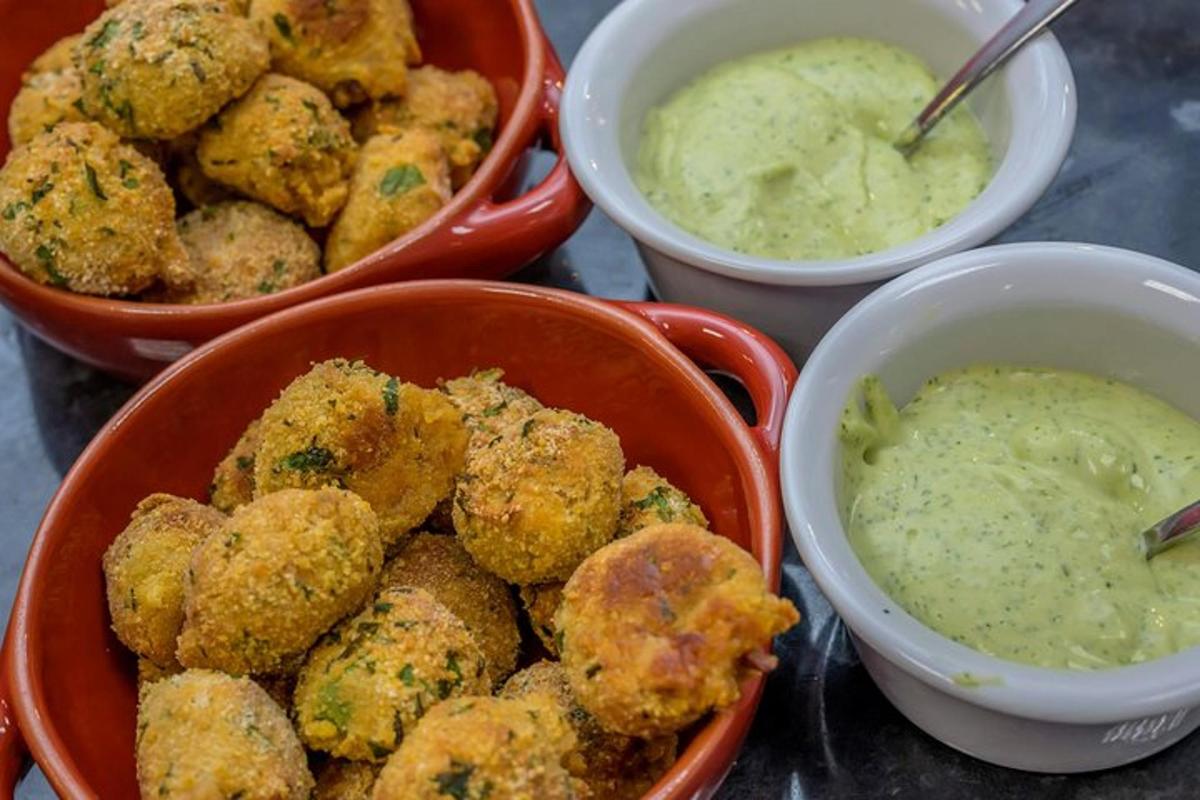 four bowls of food with dipping sauce and someifloweritures