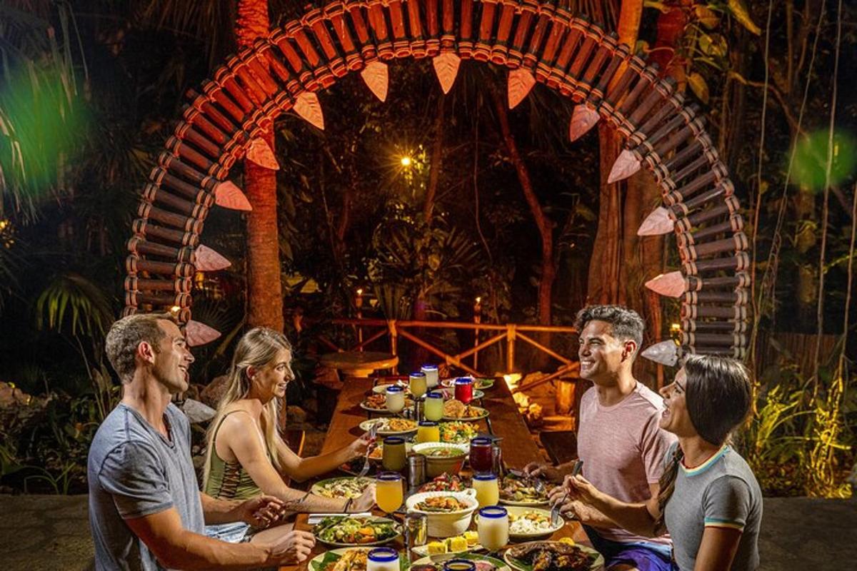 a group of people sitting around a table with food