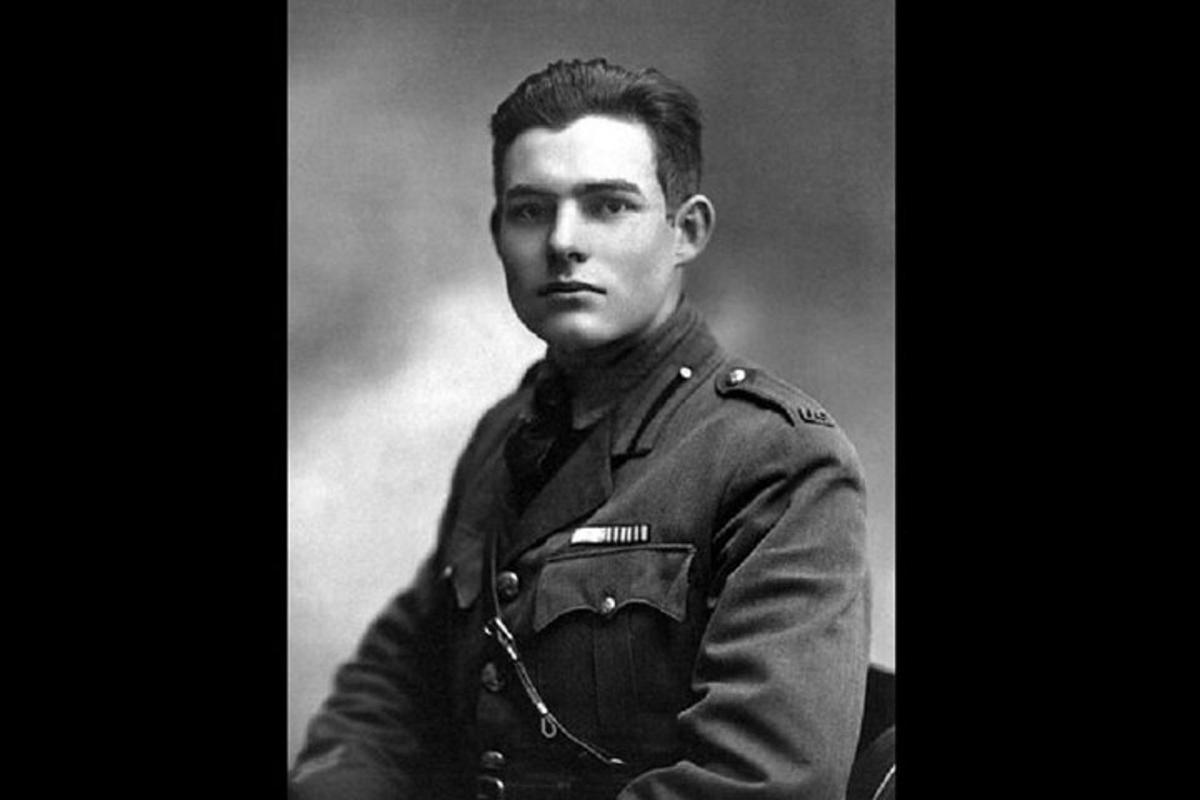 a black and white photo of a man in uniform