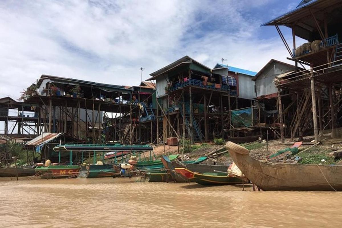 a group of buildings with boats in the water