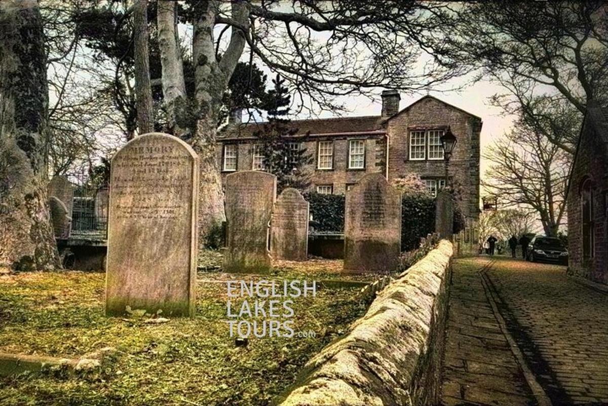 a group of graves in front of a house