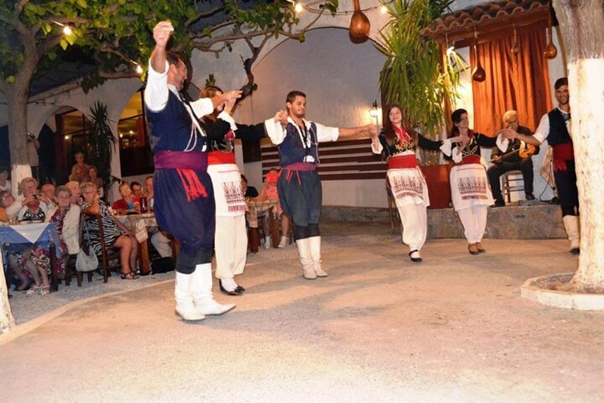 a group of people dancing in front of a crowd