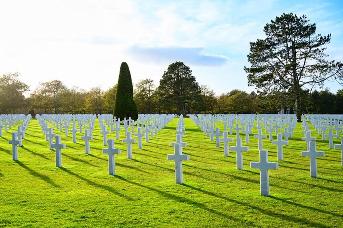 a group of graves in a grass field