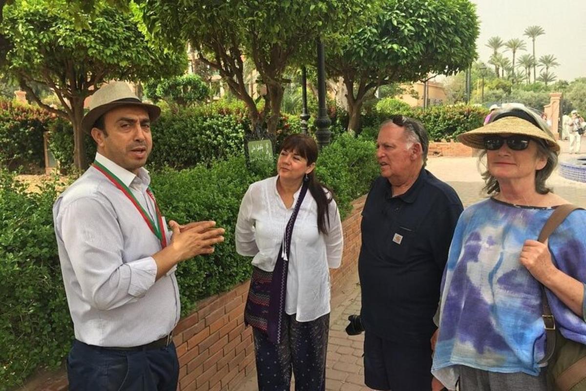 a group of people standing around in a park