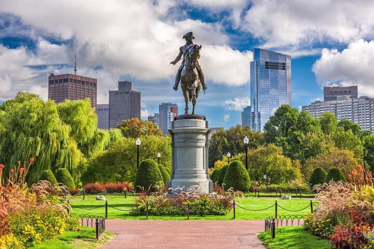 a statue of a man on a horse in a park