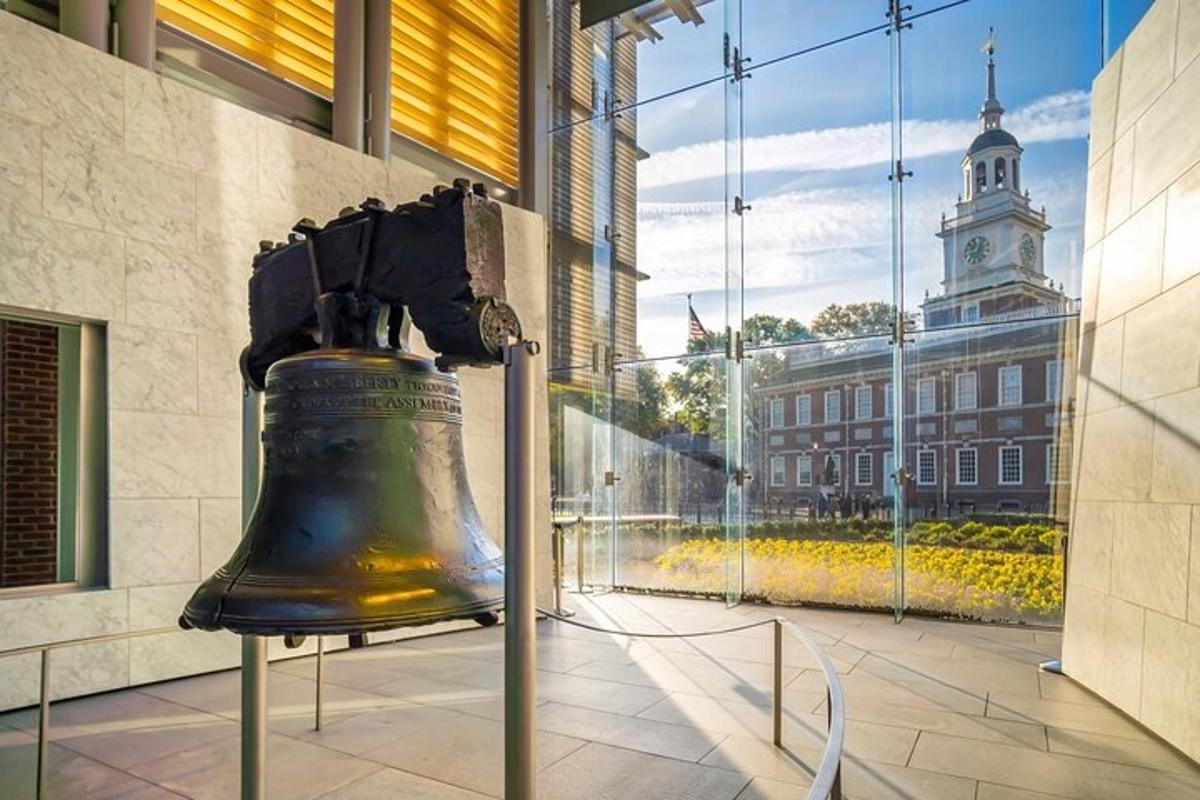 a large bell in a building with a clock tower