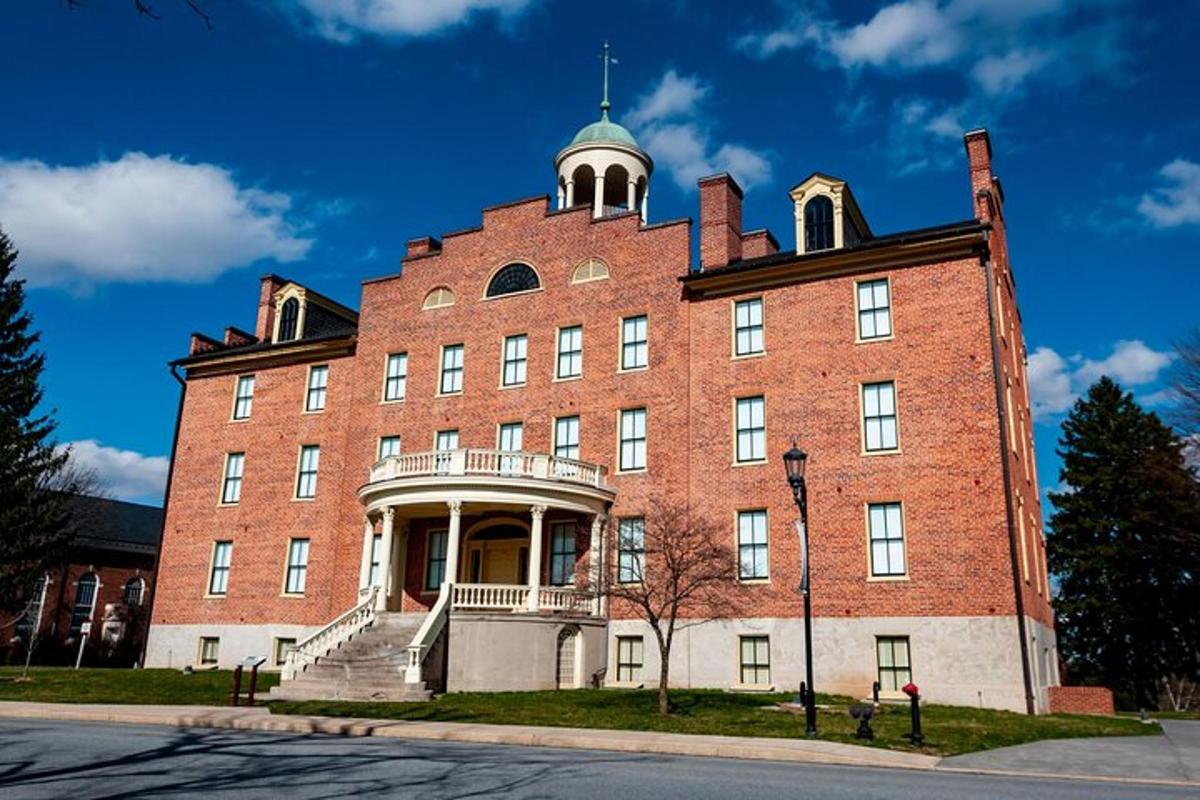 a large red brick building with a tower
